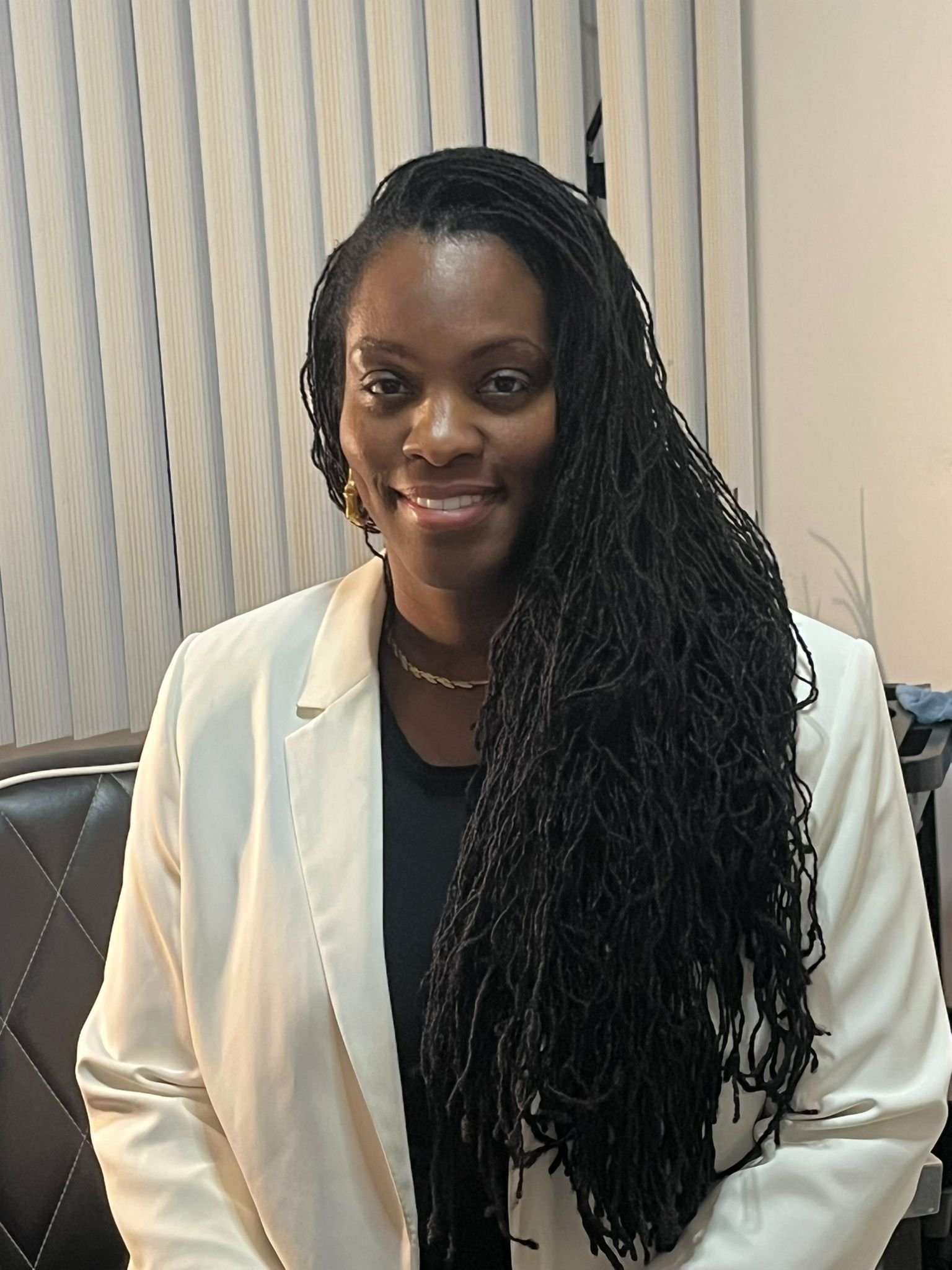 Model posing after her Sisterlocks session at Lock by Rose
